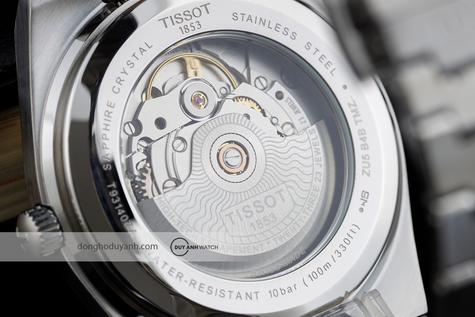 Mặt đáy Tissot PRX Powermatic 80 Steel 18K Gold T931.407.41.031.00