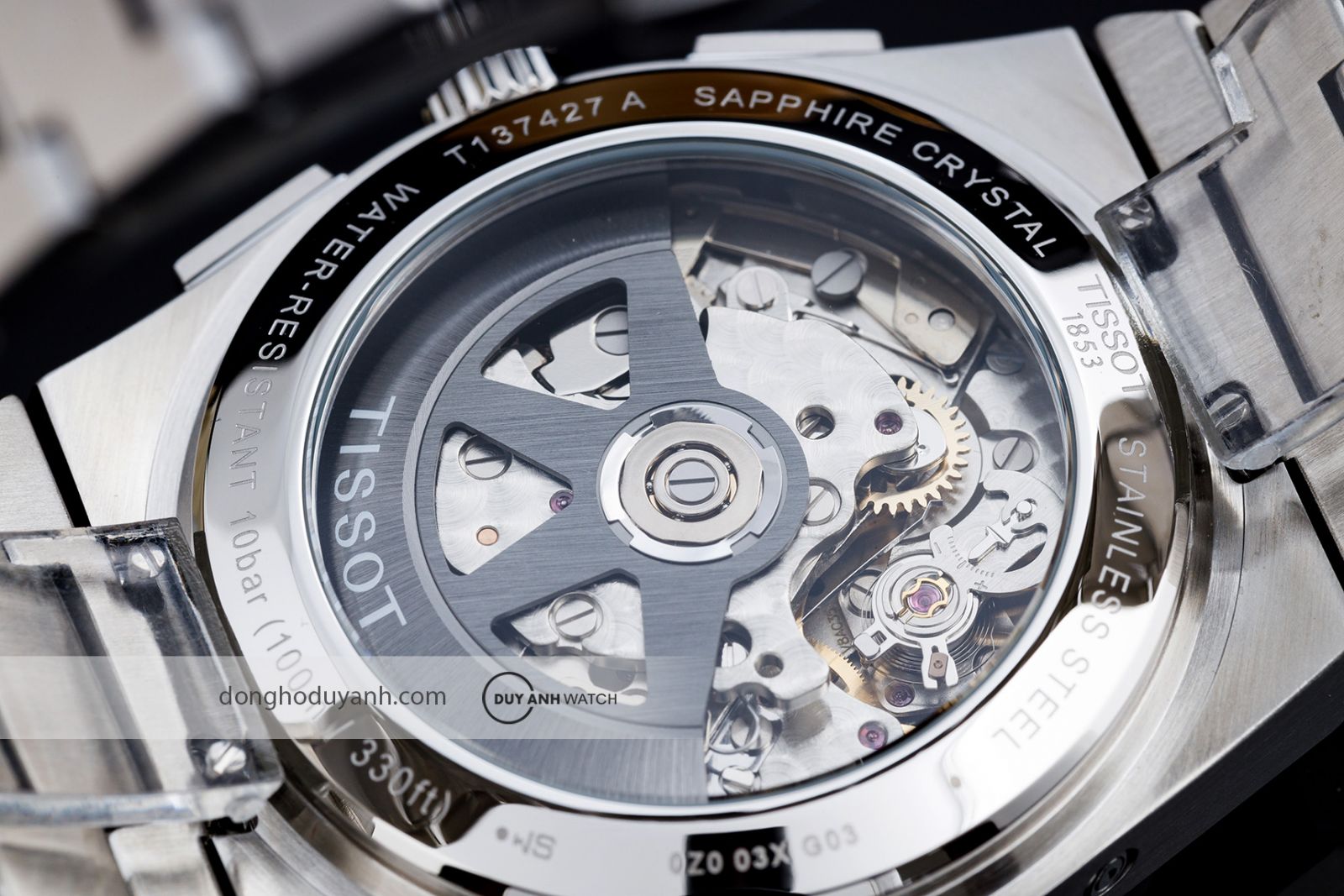 Mặt đáy Tissot PRX Chronograph T137.427.11.011.00