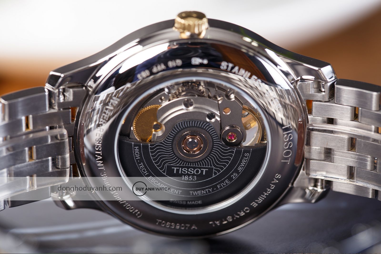Mặt đáy Tissot Tradition Open Heart T063.907.22.038.00